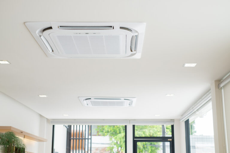 Ceiling-mounted cassette air conditioners installed in a modern space, illustrating commercial aircon installation for offices, retail shops, and corporate environments by Peakcool.